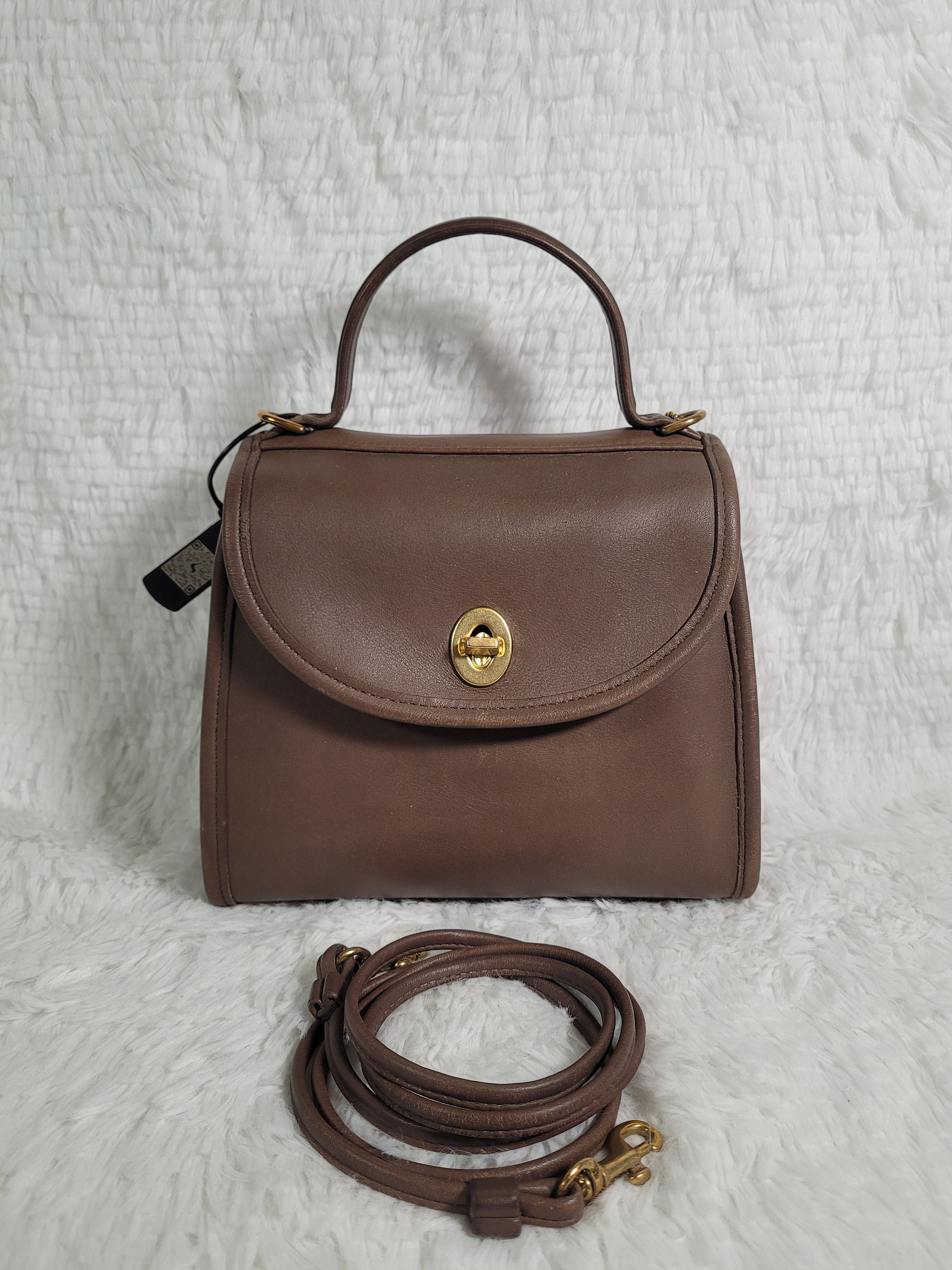 How much is a vintage coach regina taupe now? Understand its current value range.